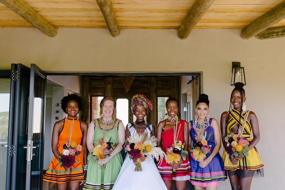 Mix and Match Traditional African bridesmaids from South Africa. The bridesmaids African dresses are simply stunning.