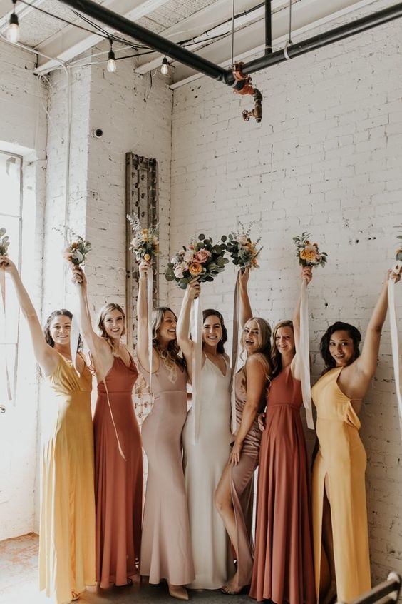Elegant mismatched bridesmaid dresses.Check out these amazing tropical mismatched bridesmaid dresses. You want to see these Bridal Parties Who Perfected The Mismatched Dress Trend Mismatched never looked so good.Mismatched bridesmaids dresses is the trend now. This trend helps each maid come out confident and also express her fashion sense.