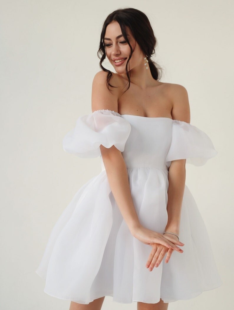 Looking for some inspiration for your bridal shower outfit? Look no further! We've rounded up the latest trends and classic styles to help you find the perfect look for your special day. From flowy maxi dresses to chic jumpsuits, our ideas cover a range of styles and budgets. Whether you're going for a casual backyard gathering or a fancy brunch, we have you covered. So get ready to turn heads and feel confident in your bridal shower outfit! 