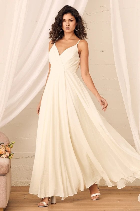 If you are looking for affordable wedding dresses that are less than $100, click here. SHOP LULU’S WEDDING DRESSES: 11 WEDDING DESIGNS FOR UNDER $100 - ALL ABOUT LOVE CREAM MAXI DRESS