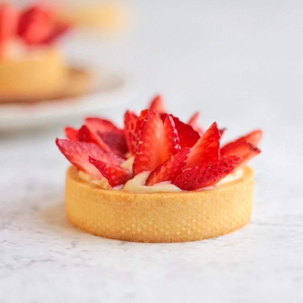 These Mini Strawberry Tarts with Custard Filling is the ultimate Summer dessert recipe! The Easy French Strawberry Tarts, filled with Creme Patissiere are a delicious summer dessert for a garden party or afternoon tea party. With its Pastry Cream Tart Filling, fresh strawberries and almond shortcrust pastry, the Strawberry Tartlets are the perfect combo of creamy, crunchy, flakey, sweet and tart! A must-try strawberry dessert idea! #strawberry #tarts #tartlet #minitart #custard #frenchpastry