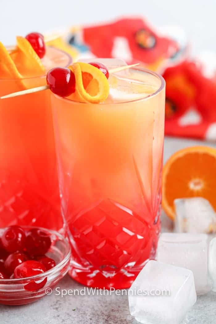 Make the Perfect Tequila Sunrise Drink for your summer wedding. A Tequila Sunrise uses tequila, orange juice, and grenadine syrup. A beautiful cocktail that gets its name from colors combining to look like a sunrise