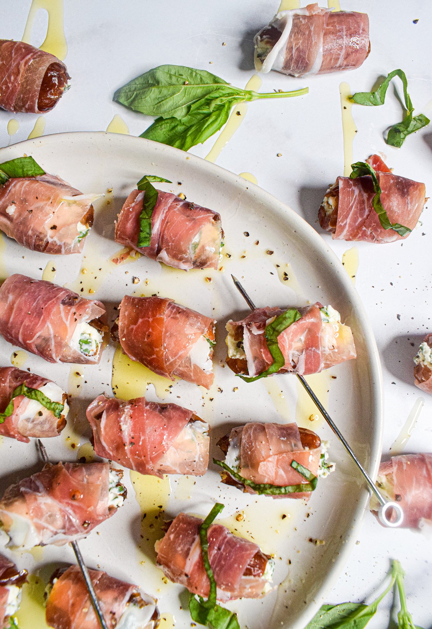 The key to keeping your cool is to do as much as you can ahead of time — for us, this means choosing easy, make-ahead holiday appetizers. With that in mind, these Prosciutto-Wrapped Dates with walnuts and goat cheese can be made well before the party starts and heated just before serving.