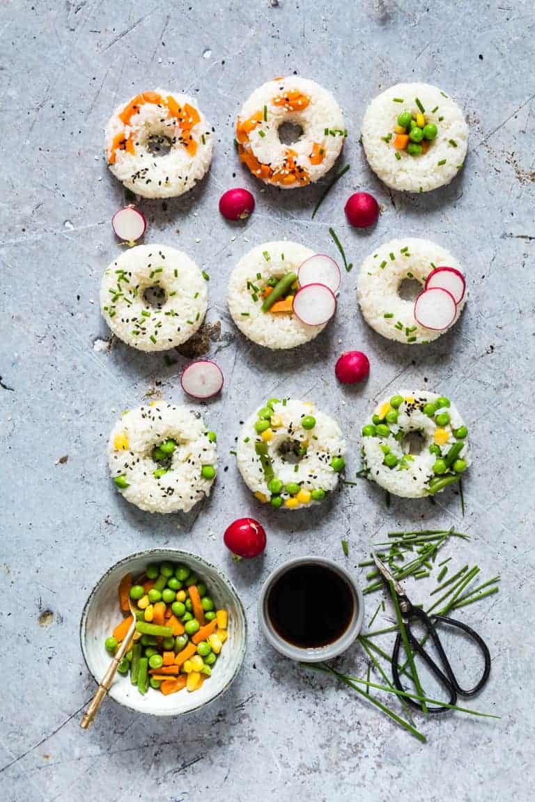 Elegant Vegetable Sushi Donuts perfect for weddings to be served during wedding cocktail hour. Rainbow Veggie Sushi Donuts are light, refreshing and fun! They make a perfect activity for date night, or dinner with your girls. Dip in tamari or try my tamari almond butter sauce.