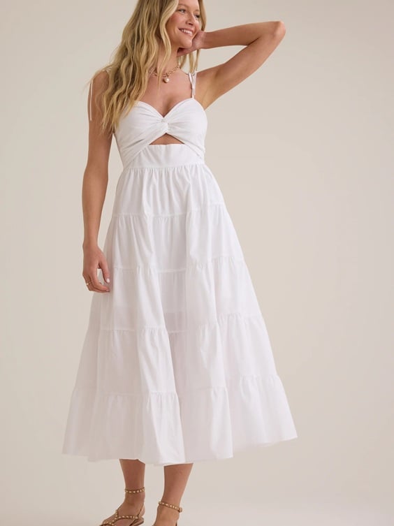 If you are looking for a gorgeous long flowy dress for an engagement shoot, check out this stunning white Maxi Dress! It's the perfect engagement photo outfit!