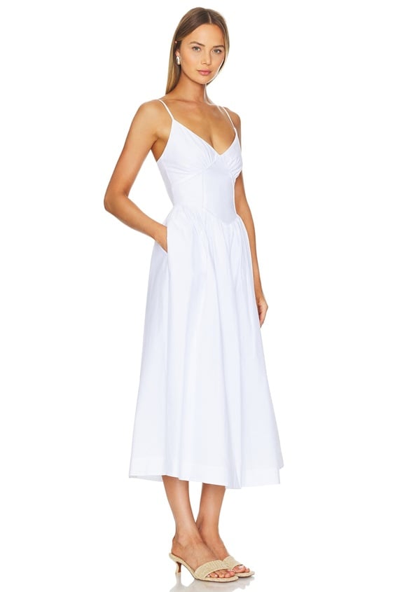 Gorgeous blush maxi dress for engagement shoot. Cute flowy dress for taking photos in summer.