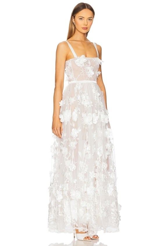 Are you looking for the perfect outfit for your engagement photos? Look no further than this stunning maxi dress! With its flowing silhouette and romantic details, this dress will make you feel like a princess. The dress features delicate lace accents and a flattering sweetheart neckline, perfect for a beach or outdoor setting. Pair it with your favourite sandals or heels for an effortless and elegant look. Whether posing for photos with your future spouse or enjoying a day in the sun, this maxi dress will make you feel beautiful and confident.