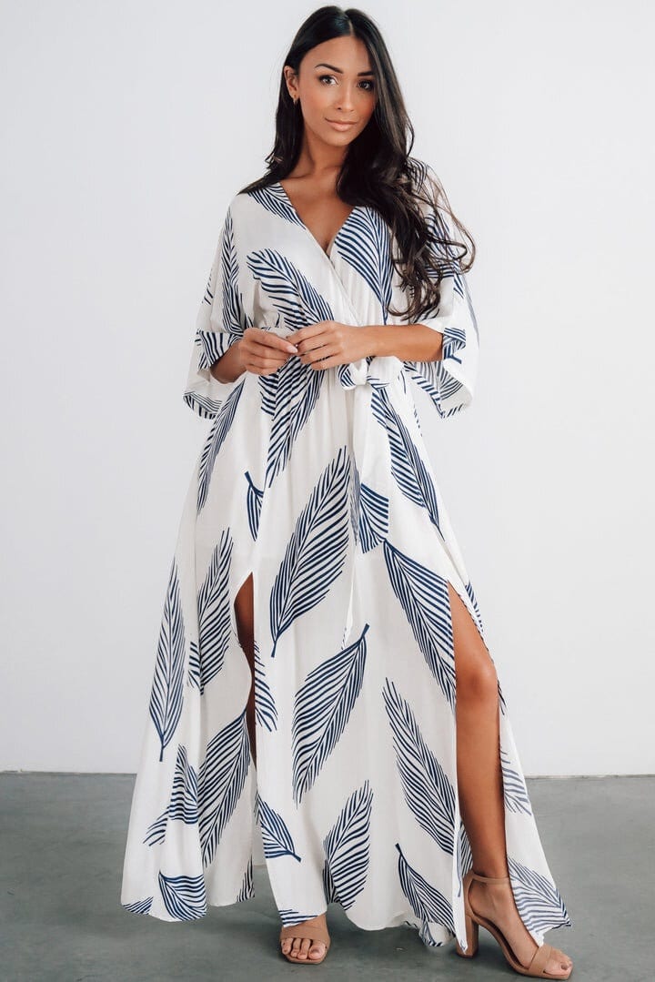 Are you looking for the perfect outfit for your engagement photos? Look no further than this stunning maxi dress! With its flowing silhouette and romantic details, this dress will make you feel like a princess. The dress features delicate lace accents and a flattering sweetheart neckline, perfect for a beach or outdoor setting. Pair it with your favourite sandals or heels for an effortless and elegant look. Whether posing for photos with your future spouse or enjoying a day in the sun, this maxi dress will make you feel beautiful and confident.