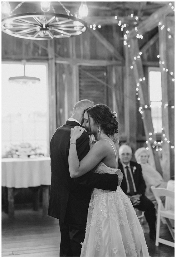 A gorgeous shot of father and daughter dancing at a wedding. Check these amazing country songs about dads and daughters to play at your daughter’s wedding or something to listen to because you love your little girl, we have something for you on the blog.