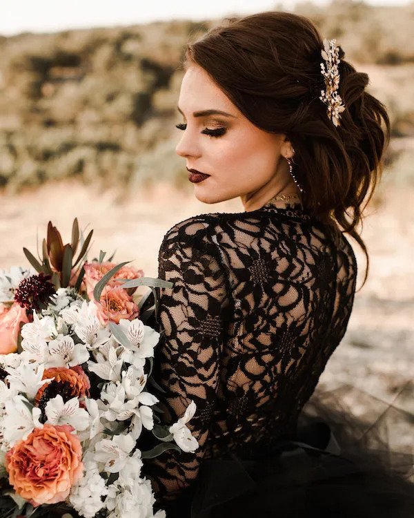 Casting a spell Halloween wedding Styled shoot! Beautiful bride wearing a black wedding dress for a Halloween-inspired wedding styled-shoot! I am in love with this lace black wedding dress! Black wedding dresses are the fashion trend for modern brides. Check out this amazing wedding Halloween inspiration today!