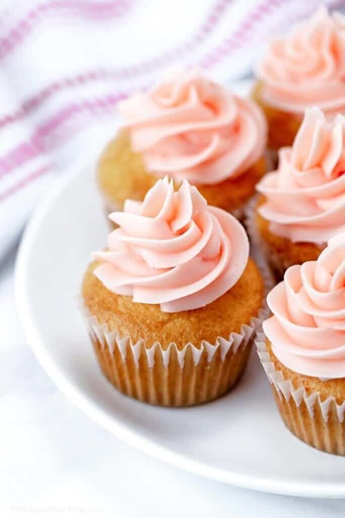 Pink champagne cupcakes for bridal showers! Made with real sparkling wine and homemade champagne buttercream frosting, they are a fun and festive dessert for any special occasion!