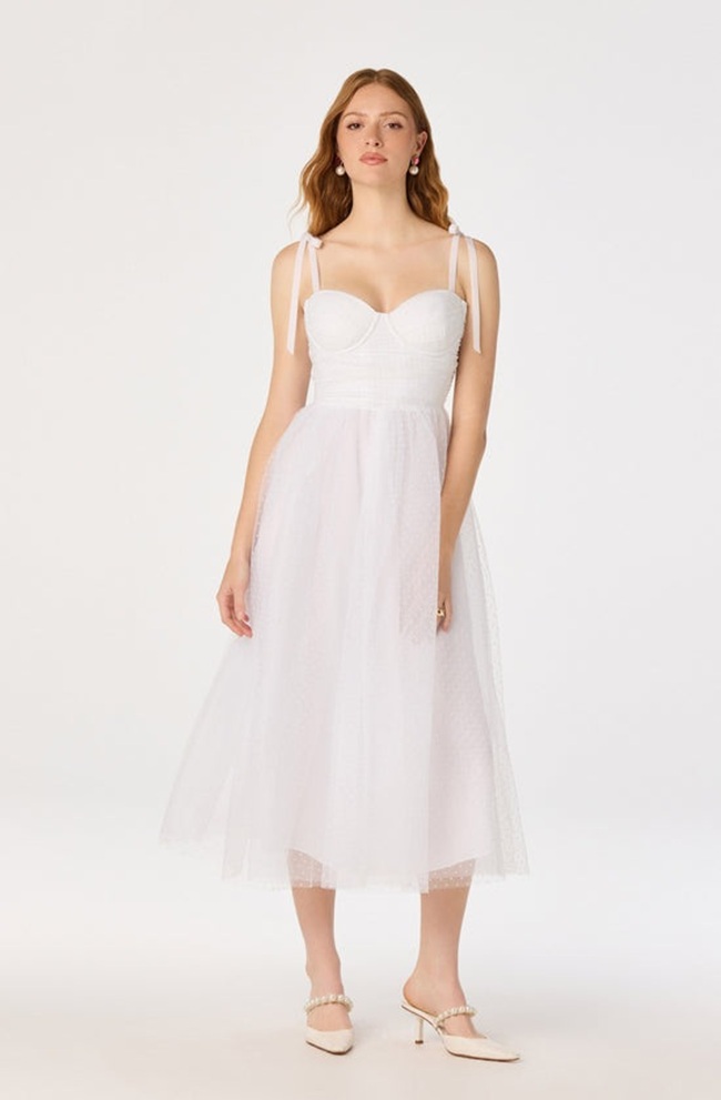 Looking for some inspiration for your bridal shower outfit? Look no further! We've rounded up the latest trends and classic styles to help you find the perfect look for your special day. From flowy maxi dresses to chic jumpsuits, our ideas cover a range of styles and budgets. Whether you're going for a casual backyard gathering or a fancy brunch, we have you covered. So get ready to turn heads and feel confident in your bridal shower outfit!
