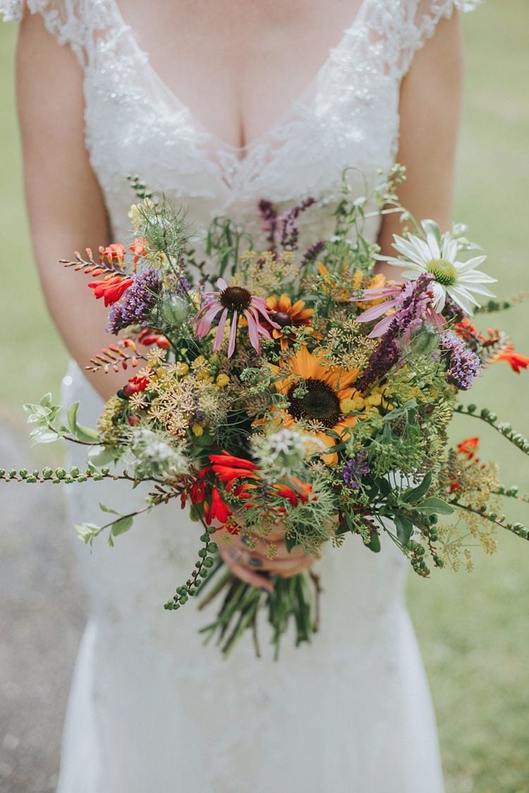 This beautiful bouquet features vibrant sunflowers that will brighten up any room. The smell also includes a mix of other colourful flowers, such as roses and daisies, that complement the sunflowers perfectly. The arrangement is expertly crafted to create a stunning visual display that is both elegant and cheerful. Whether you want to add a pop of colour to your home or surprise someone with a thoughtful gift, this sunflower bouquet will surely impress.