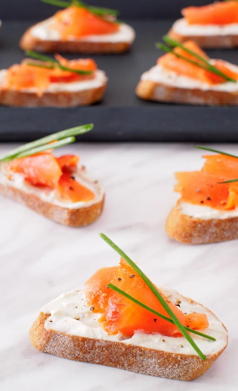 Looking for the ideal appetizer to elevate your bridal shower or wedding reception? These Smoked Salmon and Boursin Crostini are a must-try! Each bite combines the silky richness of smoked salmon with the creamy, herbed goodness of Boursin cheese, all resting on a crispy crostini. Not only are they a feast for the taste buds, but they also add a touch of elegance to your spread. Easy to prepare and sure to impress, these crostini are the perfect blend of simplicity and sophistication. Pin now and make your special day even more memorable!