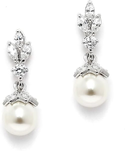 Check out these timeless beauty with our exquisite pearl drop bridesmaid earrings, a perfect blend of classic sophistication and modern elegance. Each earring features a lustrous pearl delicately suspended from a shimmering silver or gold setting, offering a graceful movement that catches the light with every step. These earrings are designed to complement any bridesmaid dress, adding a touch of refinement to your bridal party's ensemble. A symbol of purity and love, pearl drop earrings serve as a cherished keepsake, capturing the joy and memories of your special day. Ideal for weddings and beyond, these earrings are a versatile accessory that your bridesmaids will treasure long after the celebration.