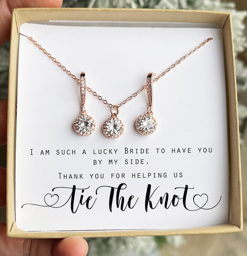 Celebrate the special bond with your bridesmaids and maid of honour by gifting them a stunning Bridesmaid Jewelry Gift Set. These elegant pieces not only enhance their wedding-day look but also serve as a lasting token of appreciation. Crafted to match your wedding theme and reflect each bridesmaid's unique style, this set is both thoughtful and timeless. With personalization options, they offer a heartfelt touch that your bridal party will cherish forever. Whether worn on the big day or for future occasions, these jewelry sets are a beautiful reminder of the love and memories you share. Choose elegance and sentimentality wrapped in a perfect package, and let your bridesmaids sparkle as they stand by your side on your unforgettable day.