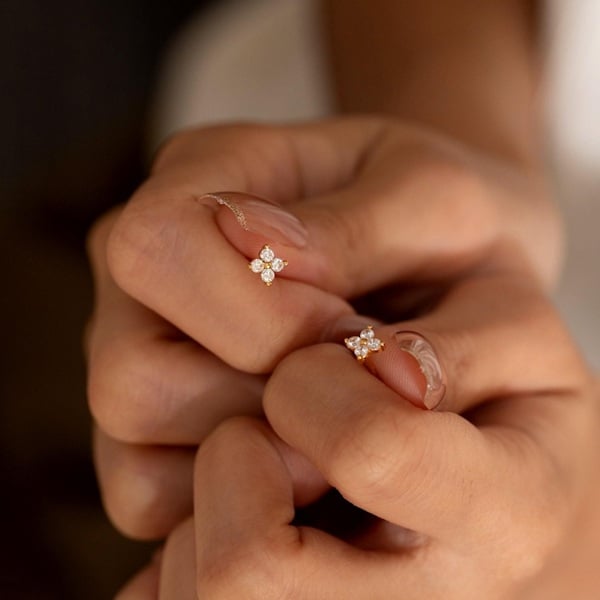 Dainty Floral Stud Earrings: A Perfect Bridesmaid Gift! Searching for an unforgettable gift for your bridesmaids and maid of honour? Consider these Dainty Floral Stud Earrings, an elegant choice that exudes charm and sophistication. These earrings are a beautiful blend of delicate design and timeless style, featuring intricate floral patterns that add a touch of nature-inspired beauty to any ensemble. They’re perfect for complementing a range of bridal themes, from vintage to modern. Crafted with precision and care, these earrings are not only a lovely keepsake from your special day but also a versatile accessory that your bridesmaids can cherish and wear on many occasions. Present these earrings to convey your heartfelt appreciation and ensure your bridal party sparkles with understated elegance.