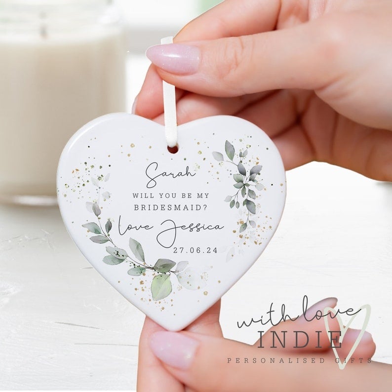 Ready to pop the question to your besties? Check out these creative ways to ask your friends to be your bridesmaids and make it a moment to remember! From personalized gift boxes filled with their favourite treats to heartfelt handwritten notes, these unique ideas will make your proposal unforgettable. Think outside the box with custom puzzles, adorable "Will You Be My Bridesmaid?" balloons, or a surprise brunch where you pop the question. Capture the moment with a Polaroid photo session or create a memory book filled with cherished moments. Your friends will love these thoughtful touches, which will make them excited to stand by your side on your big day. Get inspired and start planning the perfect bridesmaid proposal that they'll cherish forever!