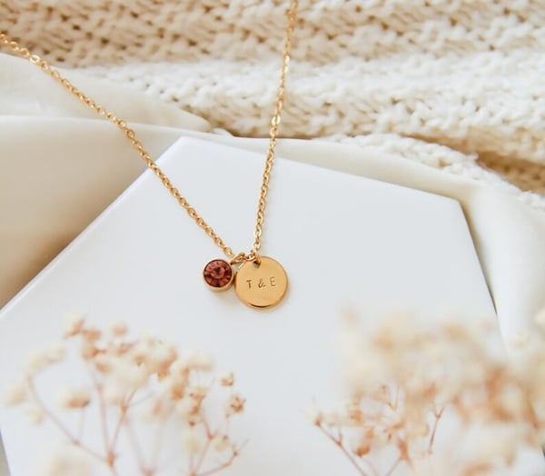 Elevate your bridesmaids' wedding day ensembles with the exquisite Initial Birthstone Necklace, the perfect blend of personalization and elegance. Why do we love it? This necklace beautifully marries each bridesmaid's initial with their birthstone, creating a unique and meaningful keepsake they'll cherish forever. It's an affordable yet thoughtful way to express gratitude and highlight their individual personalities. Crafted with care, this necklace complements any bridal theme, adding a touch of sparkle and sentiment to your special day. Perfect as a gift during the rehearsal dinner or on the wedding day morning, ensuring your bridesmaids feel truly appreciated and stylish. Choose this timeless piece to celebrate the bond you share!