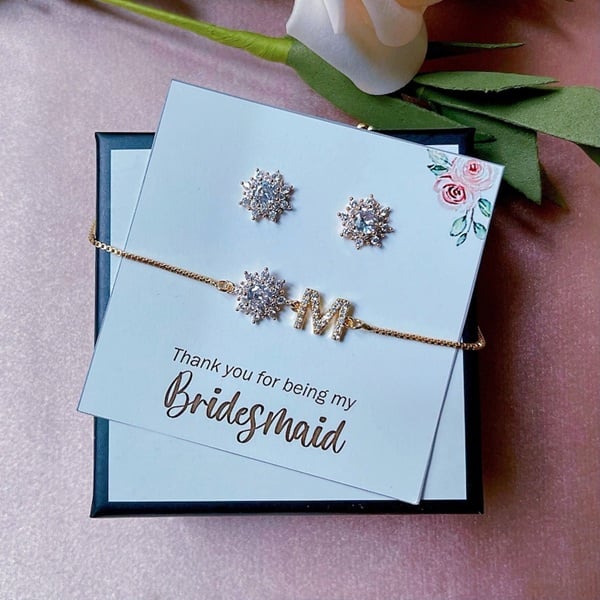 Enhance your bridesmaids' wedding day ensembles with the exquisite Crystal Bridesmaid Jewelry Gift Set. This stunning collection is a perfect blend of elegance and sentiment, offering timeless pieces that your bridesmaids and maid of honour will cherish forever. Each set includes a sparkling crystal necklace and matching earrings, designed to add a touch of glamour to their attire while beautifully complementing any wedding theme. The set is not only a stylish accessory but also a heartfelt token of appreciation, celebrating the special bond you share. It's versatile enough for future occasions, making it a memorable keepsake. Choose this jewelry set to express gratitude with sophistication and style, ensuring your bridal party shines as brightly as you do on your big day!