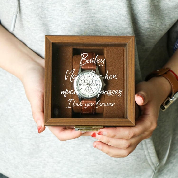 A Watch Box with Glass Top & Pillow makes an ideal groom's gift, combining practicality with elegance. This sophisticated accessory provides a stylish way to store and display his collection of timepieces. The glass top allows for a clear view of the watches, showcasing their beauty while keeping them dust-free. Each watch rests on a soft pillow, ensuring they remain scratch-free and secure. Perfect for the groom who appreciates fine craftsmanship and organization, this watch box is a timeless reminder of your special day and a thoughtful way to celebrate his personal style.