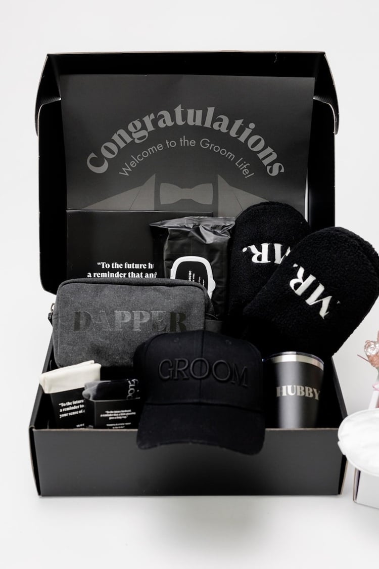 Check out these wedding day gifts for grooms! Wedding Day Groom Gift Box: A Perfect Keepsake! Check out the ultimate wedding day groom gift box that’s sure to impress! This thoughtfully curated collection includes personalized items and elegant accessories, making it the perfect keepsake for the groom. From stylish cufflinks to a classic watch, each piece is chosen to add charm and sophistication to his special day. Whether it's a touch of luxury or a heartfelt note, this gift box celebrates the groom with timeless elegance. Elevate his wedding day experience with this memorable and meaningful gift.