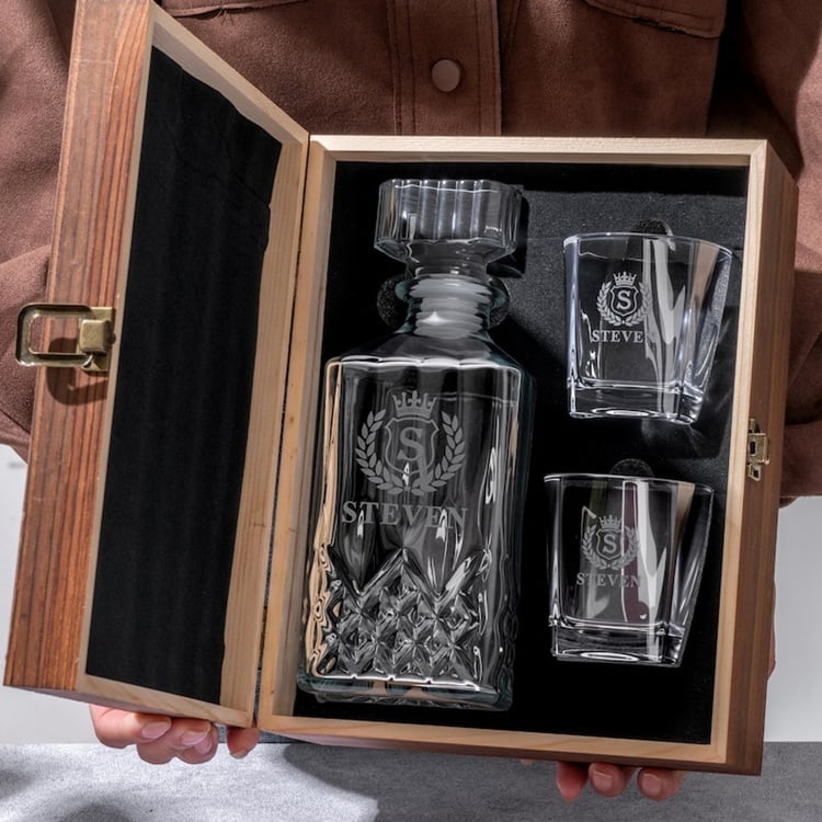 Whiskey Decanter Gift Idea for the Groom! Make the groom's special day by giving him a timeless whiskey decanter gift. Perfect for the discerning gentleman, this elegant decanter set adds sophistication to any bar or man cave. Thoughtfully crafted, it features a classic design that enhances the rich hues of his favorite whiskey. Ideal for wedding day toasts or future celebrations, it’s a keepsake that blends style with practicality. Personalize it with his initials for a unique touch. This whiskey decanter is the quintessential gift for the groom who appreciates the finer things in life.