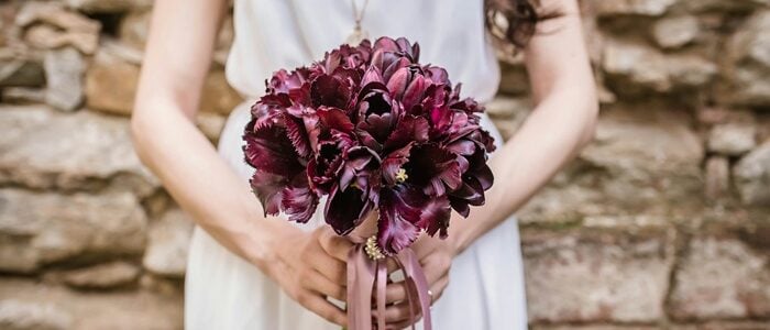 Create a stunning wedding atmosphere with a romantic plum and merlot color palette. Imagine your bridesmaids in rich plum dresses that complement the sophisticated merlot groom's suit. Enhance your venue with mesmerizing merlot and plum floral arrangements that exude elegance and charm. Top off your celebration with exquisite plum and merlot wedding cake designs that are as delicious as they are beautiful. This luxurious combination of hues promises a memorable, stylish event that leaves a lasting impression on all your guests.