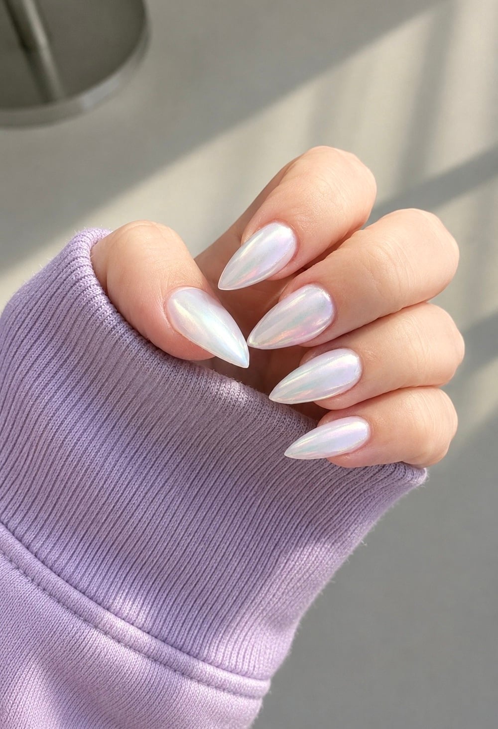 Transform your bridal look with iridescent pearl nails, the perfect choice for engaged brides-to-be. This elegant manicure trend features a stunning pearlescent finish that catches the light beautifully, adding a touch of sophistication to your wedding day ensemble. Ideal for brides seeking a unique yet timeless nail design, these nails complement any wedding theme, from classic to contemporary. Enhance your bridal style with a manicure that’s as unforgettable as your special day.