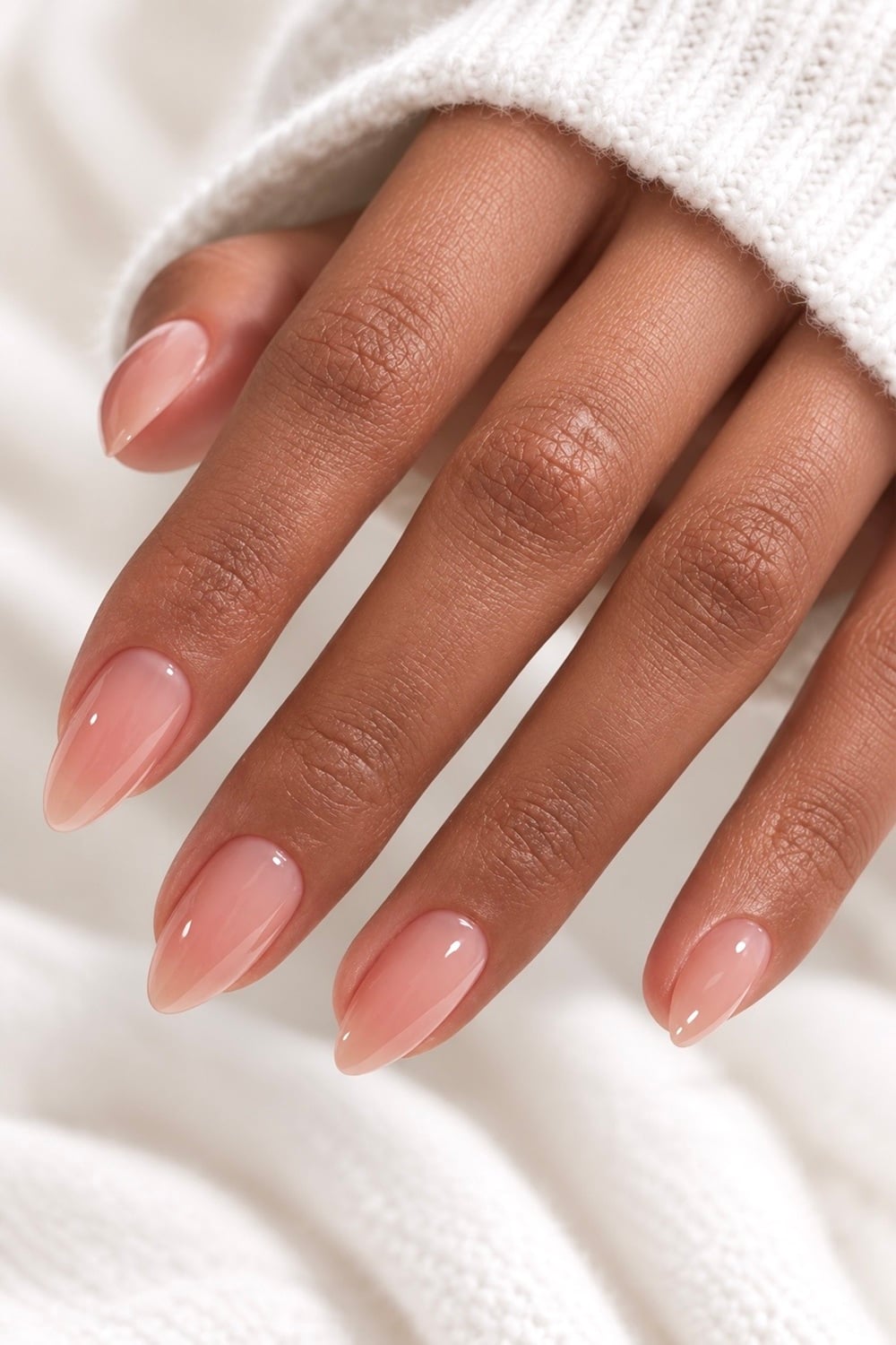 Elevate your engagement look with timeless almond nude nails. Perfect for a subtle yet elegant style, these nails are ideal for showcasing your engagement ring. With shades ranging from soft beige to warm taupe, almond nude nails complement any skin tone and outfit. Whether you're planning a surprise engagement or simply want a sophisticated manicure, these nails are a must-try. Explore trending designs like minimalist accents or chic matte finishes. Almond nude nails, engagement nails, nail design ideas, manicure trends. Find inspiration and pin your favourite designs!