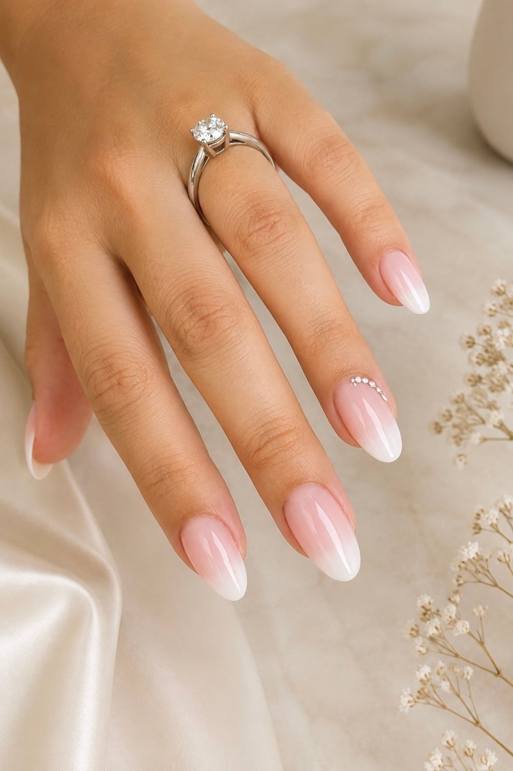 Looking for the perfect nails to complement your engagement ring? Explore these stunning white ombré nail designs that exude elegance and sophistication. Ideal for brides-to-be, these nails blend seamlessly from soft white to a natural base, creating a subtle yet striking look. Engagement nail inspiration, bridal nail trends, and chic nail art are just some of the Pinterest favourites you'll find. Whether you’re planning a classic ceremony or a modern celebration, these nails are sure to shine. Save these ideas to your board and start planning your dream bridal look today!