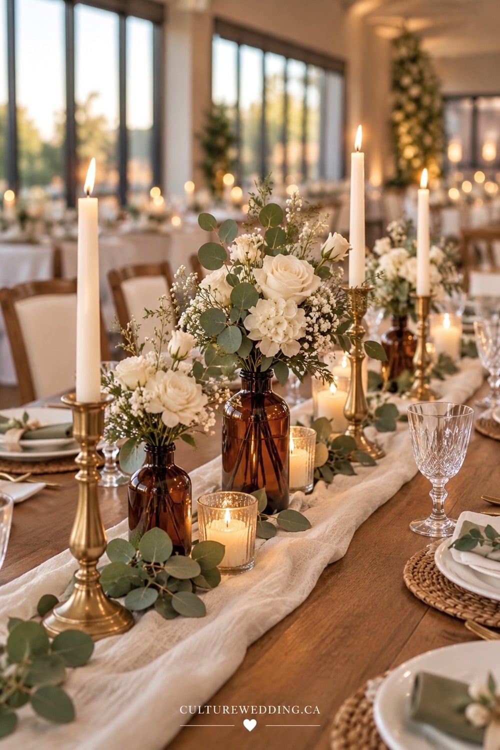 Looking for elegant fall wedding centerpiece ideas? 🍂🤍 Amber glass and white flowers make the prettiest autumn wedding table decor! These warm amber vases paired with white roses, seasonal blooms, eucalyptus and soft greenery create a romantic, timeless fall tablescape. Perfect for rustic, elegant, minimalist and budget-friendly weddings, these simple fall centerpieces are easy to recreate for your reception tables. Save this white and green fall wedding inspiration for your autumn wedding!